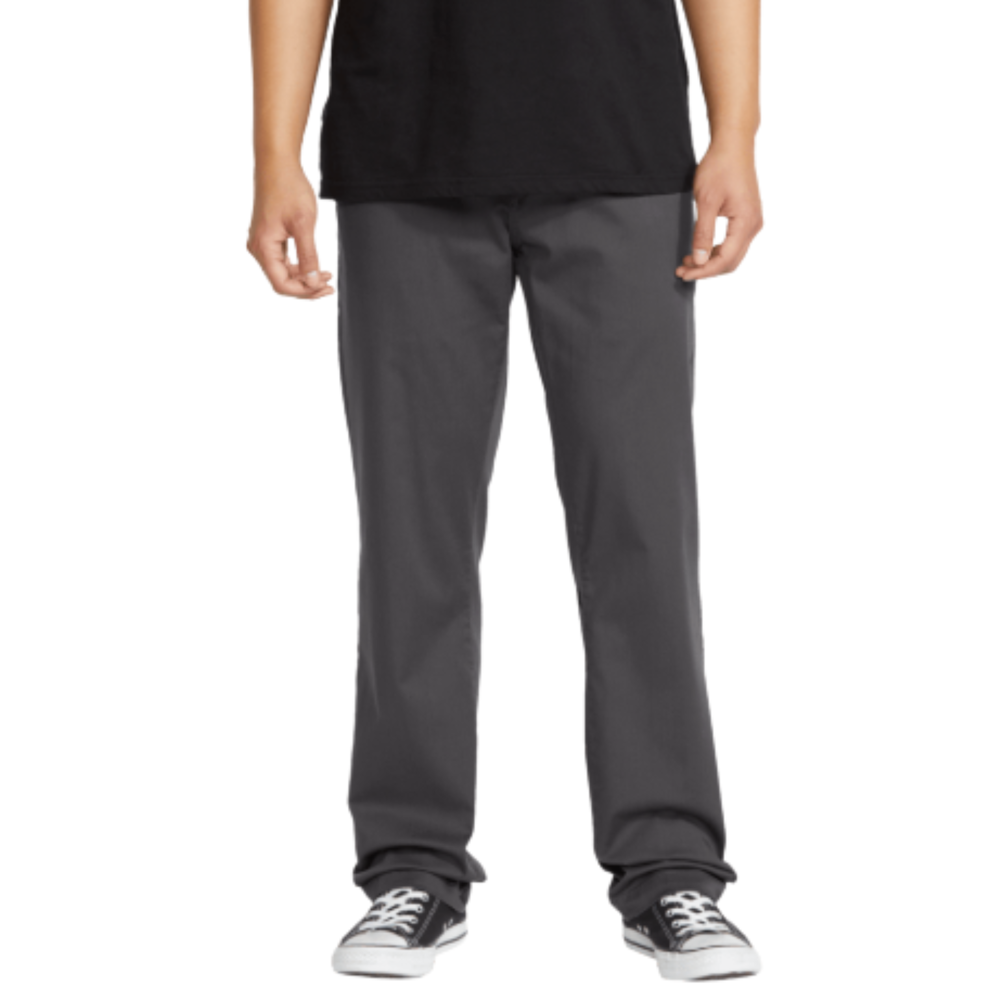 A person wearing dark gray volcom frickin stretch chino pants straight-leg work pants, a black t-shirt, and black canvas sneakers, shown from the waist down against a plain white background.