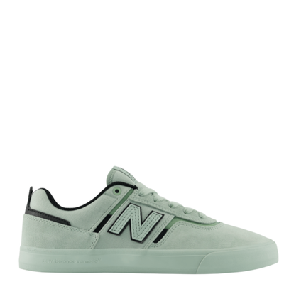 Light green new balance numeric jamie foy 306 signature sneaker with black accents on a white background