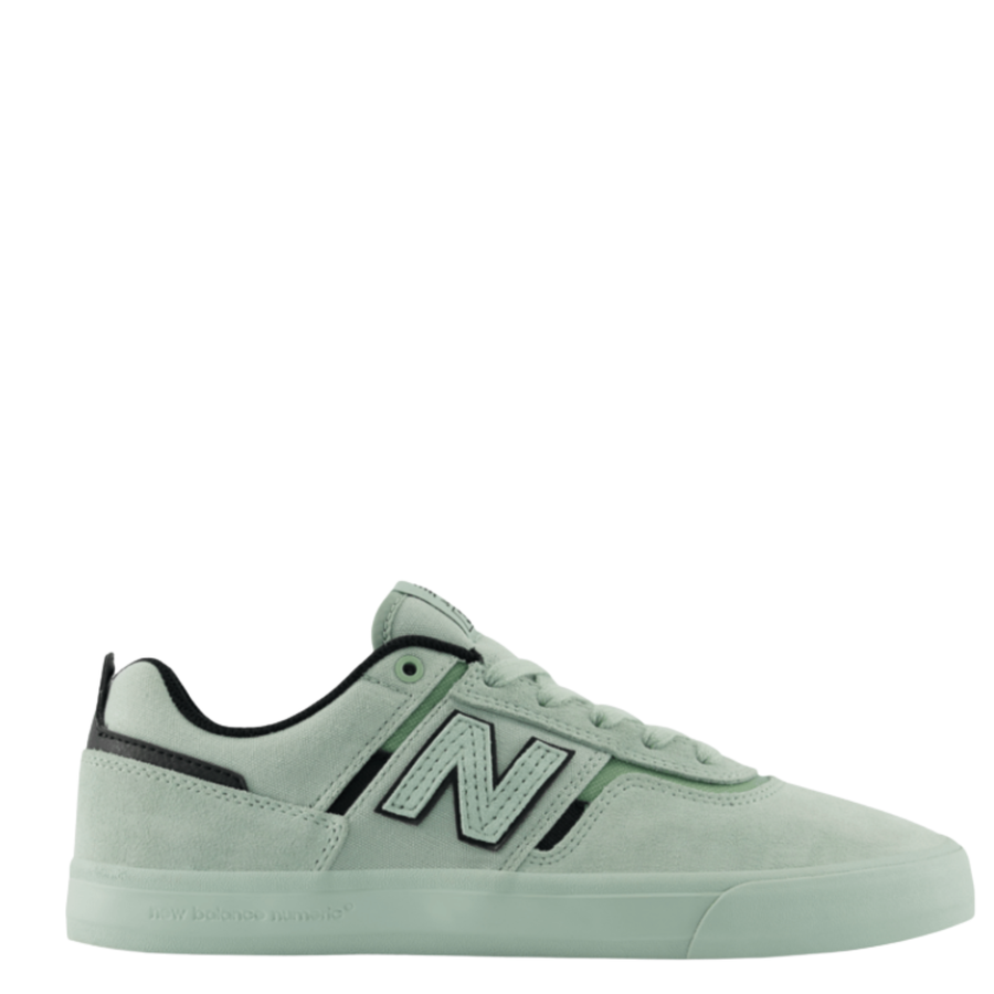 Light green new balance numeric jamie foy 306 signature sneaker with black accents on a white background
