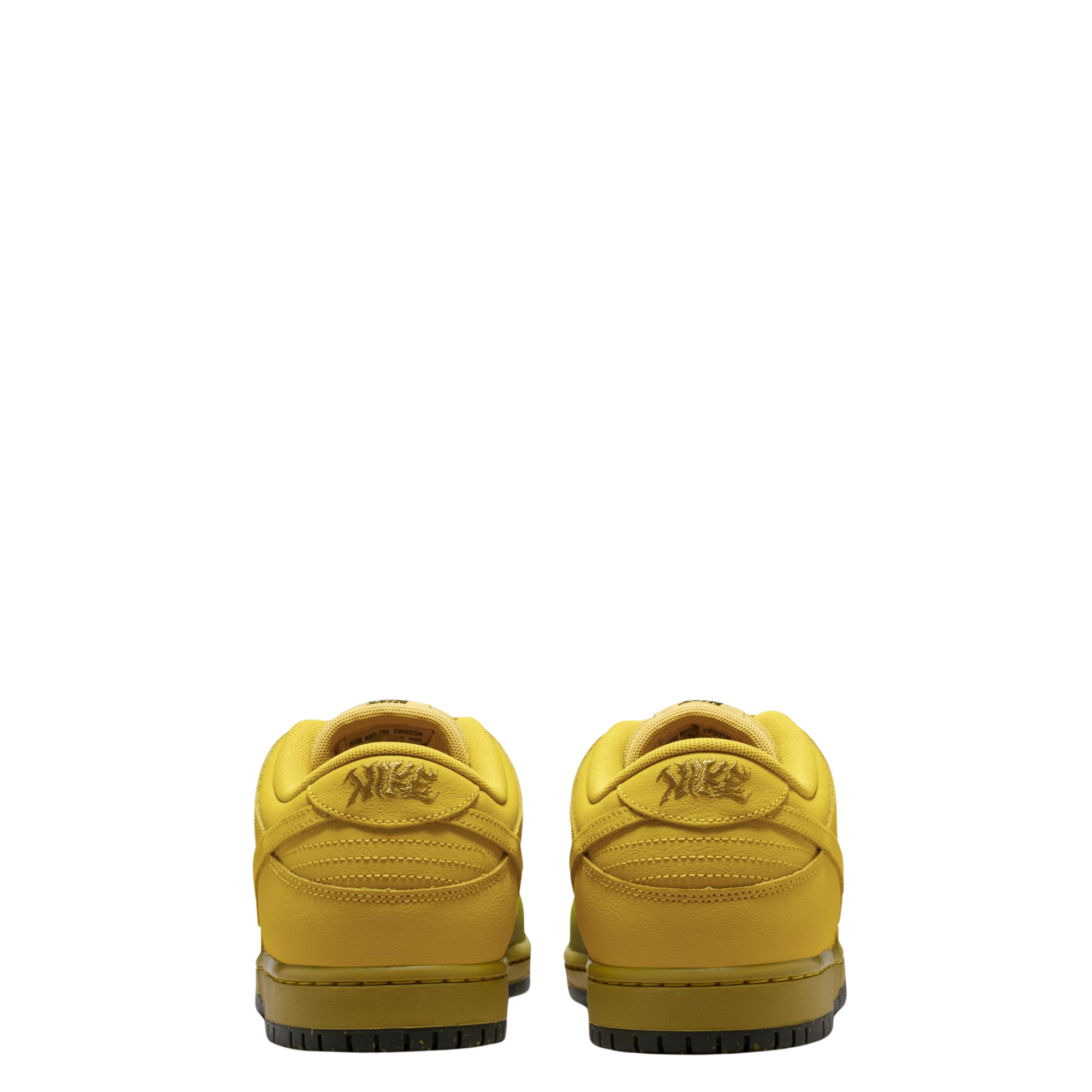 A Nike SB Saffron Dunk Low sneaker in a yellow, tan, and sage green colorway, against a plain white background.