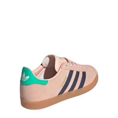 Pink Adidas Kids Juniors gazelle sneaker with green accents and three dark blue stripes on a white background