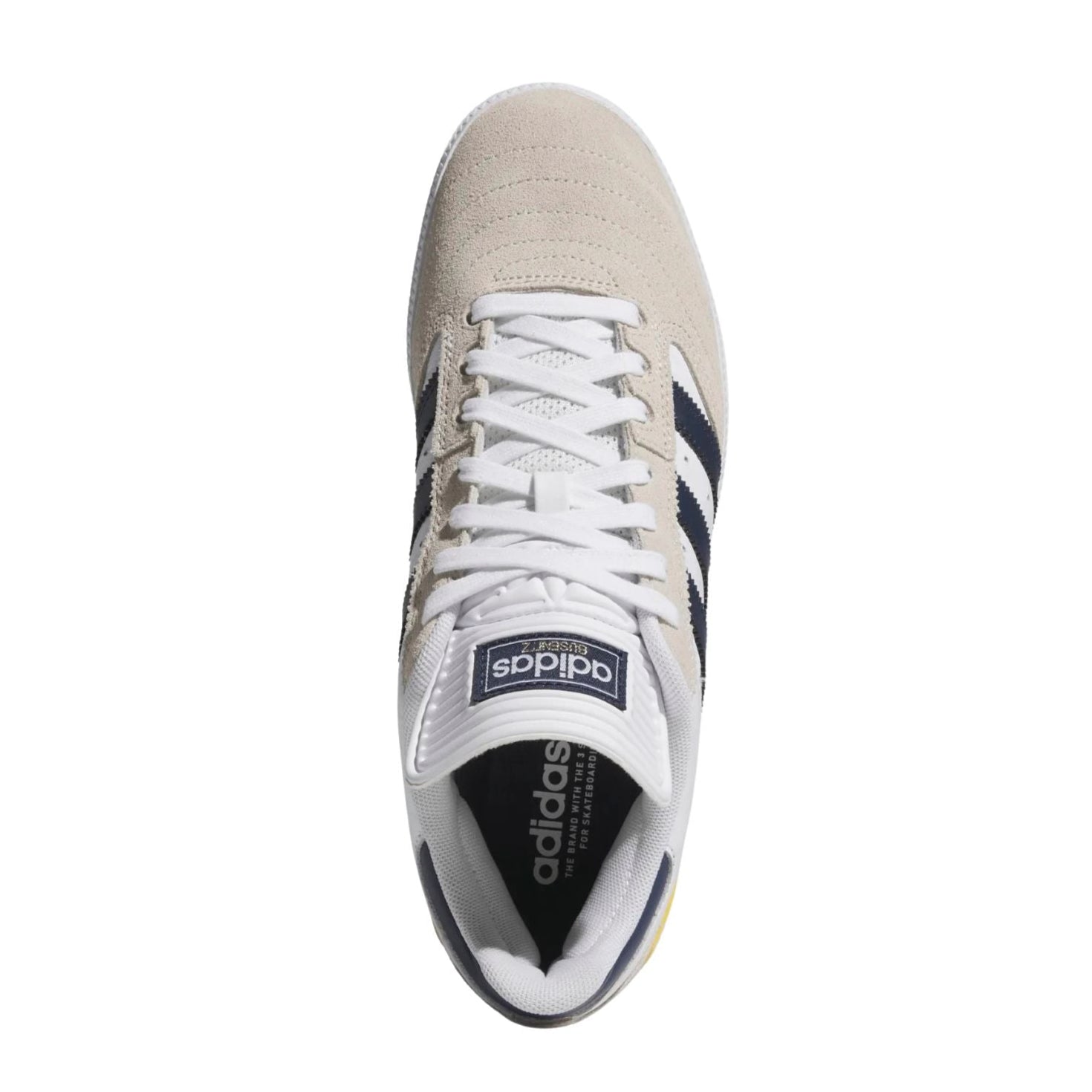 White adidas busenitz pro skateboard sneaker with navy stripes and yellow accent on a white background