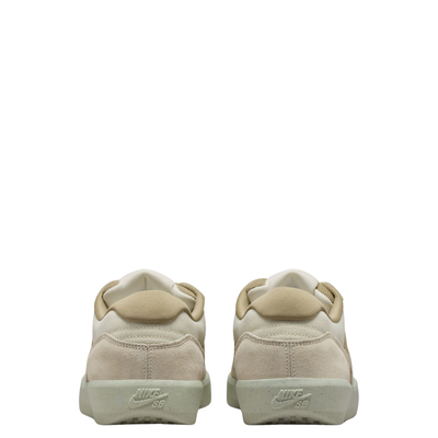 Beige nike sb force 58 sneaker with a brown accent on a white background