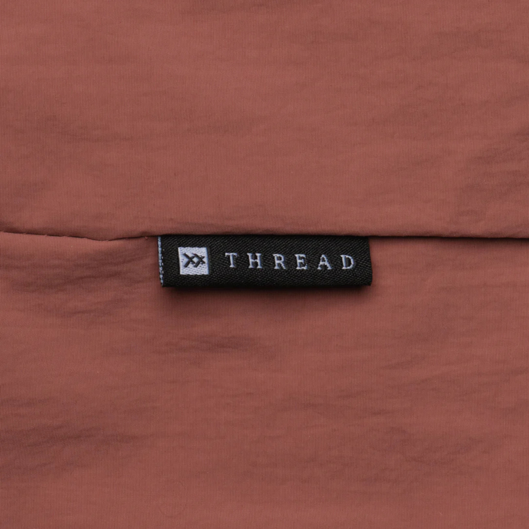 pink thread slouchy shoulder bag on a white background