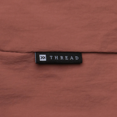 pink thread slouchy shoulder bag on a white background