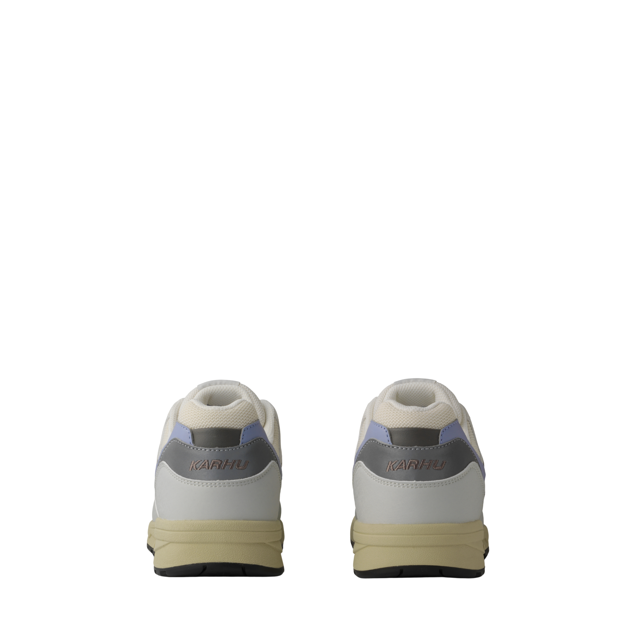 A low-top Legacy 96 sneaker by KARHU in light gray and off-white, featuring a lavender purple heel accent, dark gray side stripes, and a beige midsole.