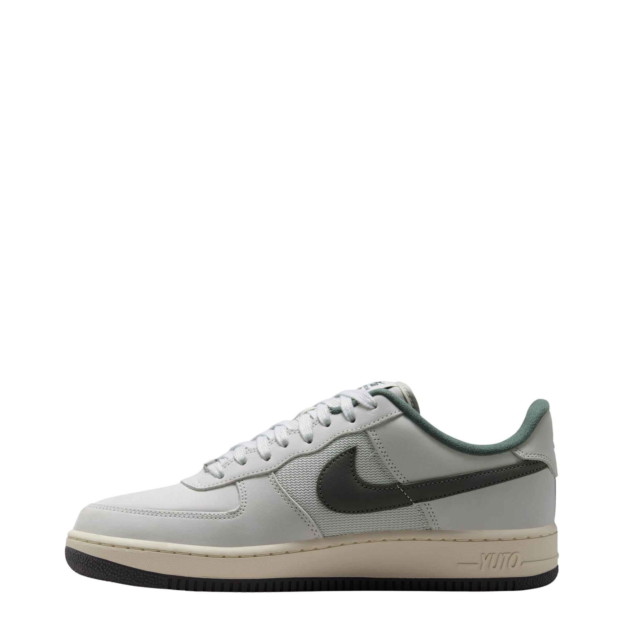 Nike sb x Yuto Air Force 1 Low skateboard sneakers in light gray and dark gray, featuring a light gray leather upper, dark gray Swoosh, and a cream midsole with a black outsole.