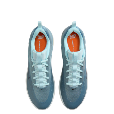 Blue nike sb zoom nyjah 4 skateboard sneaker with a white sole on a white background