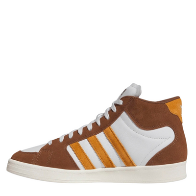 Brown and white Adidas superskate skateboard sneaker with orange accents on a white background