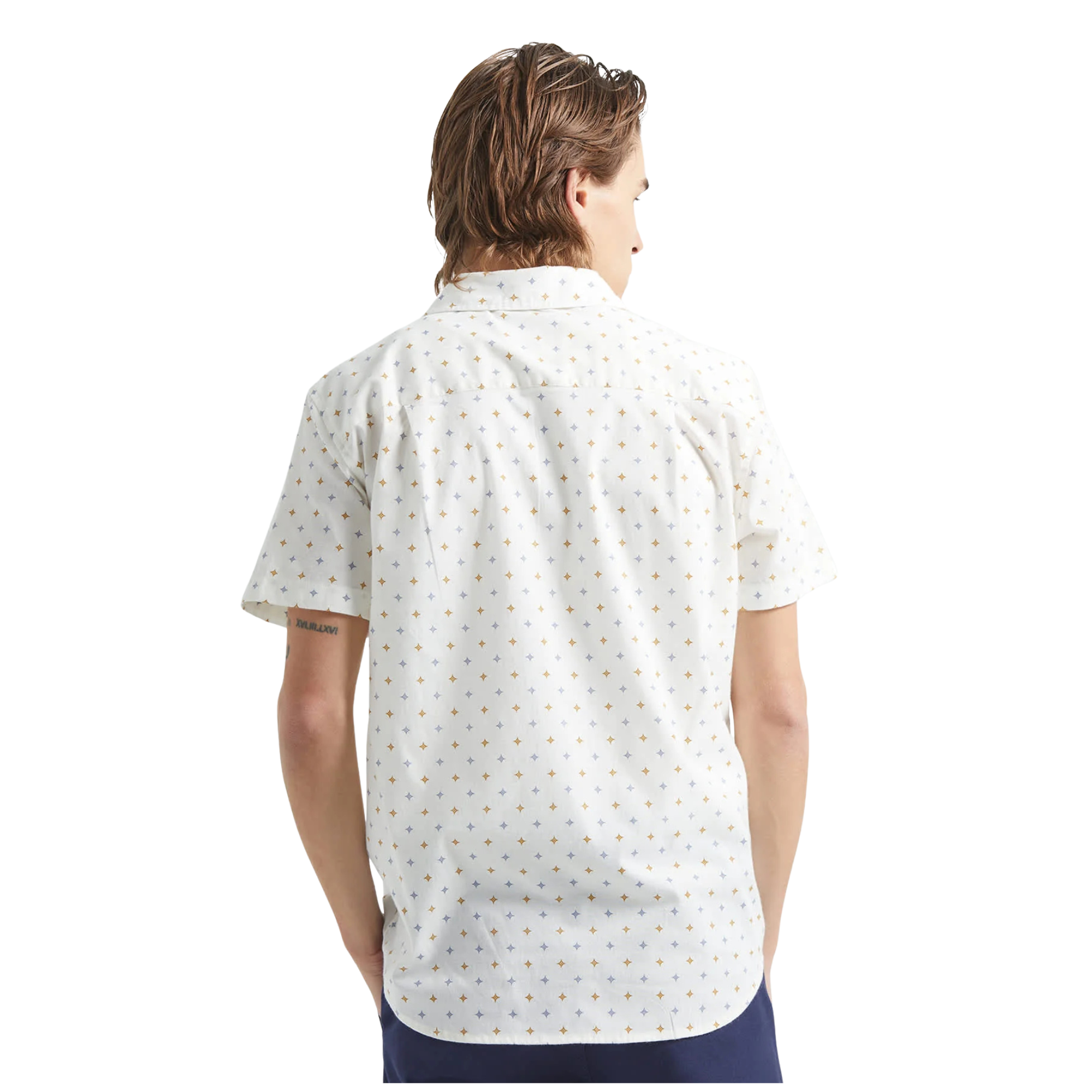 Man wearing a white brixton charter print short-sleeve shirt with a subtle pattern on a white background