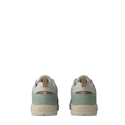 Karhu fusion 2.0 sneakers in a muted sage green, beige, and dark gray colorway, shown from a three-quarters angle against a plain white background.