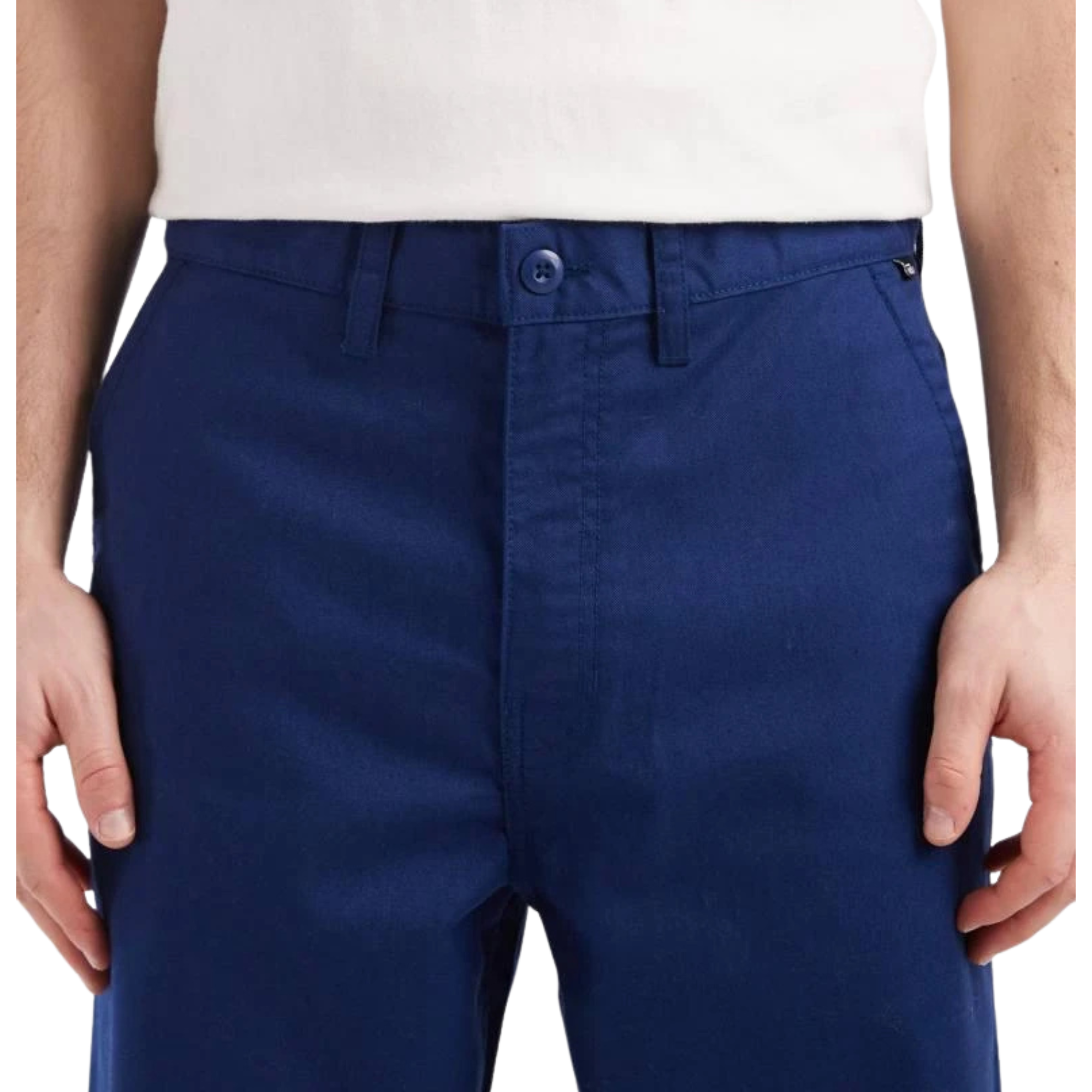 Navy blue vans pants worn by a person on a white background