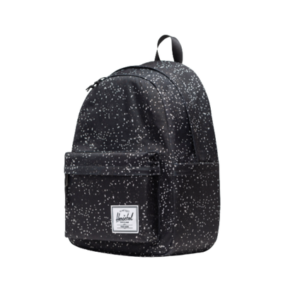 black herschel classic backpack with white blurred dots on a white background