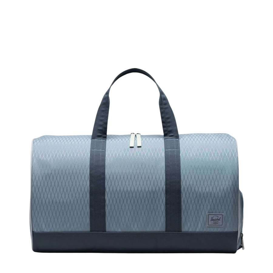 blue diamond patterened herschel novel duffle bag