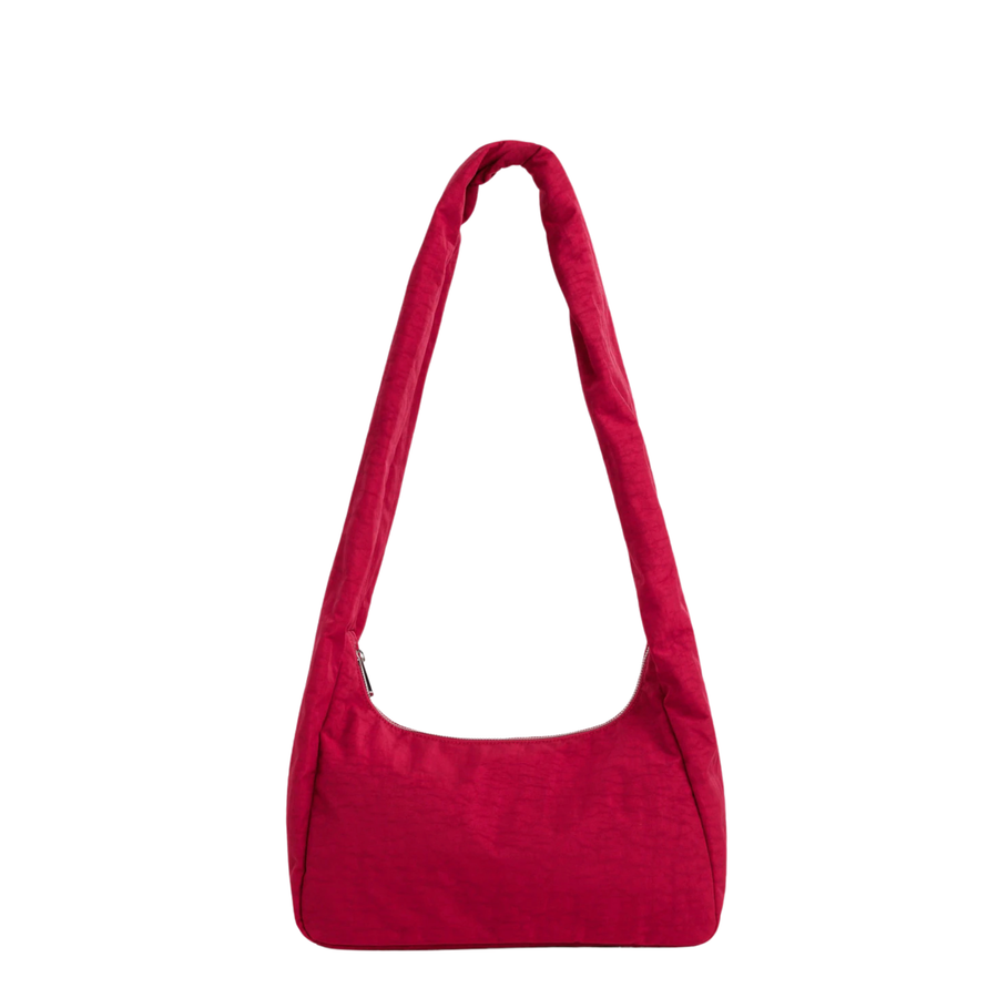 A bright red fabric baggu merigue shoulder bag with a single long strap, shown against a plain white background.