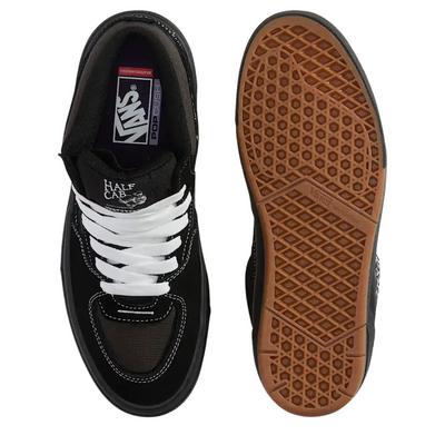 Black  vans united by skateboarding half cab mid-top sneaker with white laces on a white background