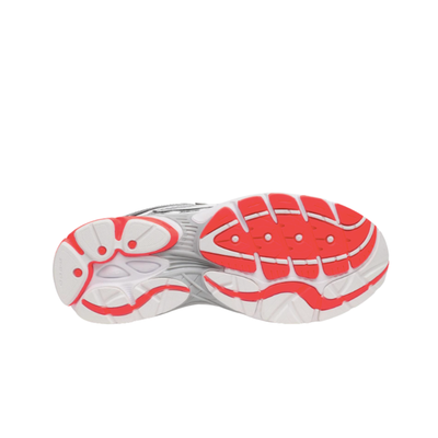 The outsole of a running shoe shown from a top-down view, featuring a white and gray textured base with vibrant red and orange grip patterns.