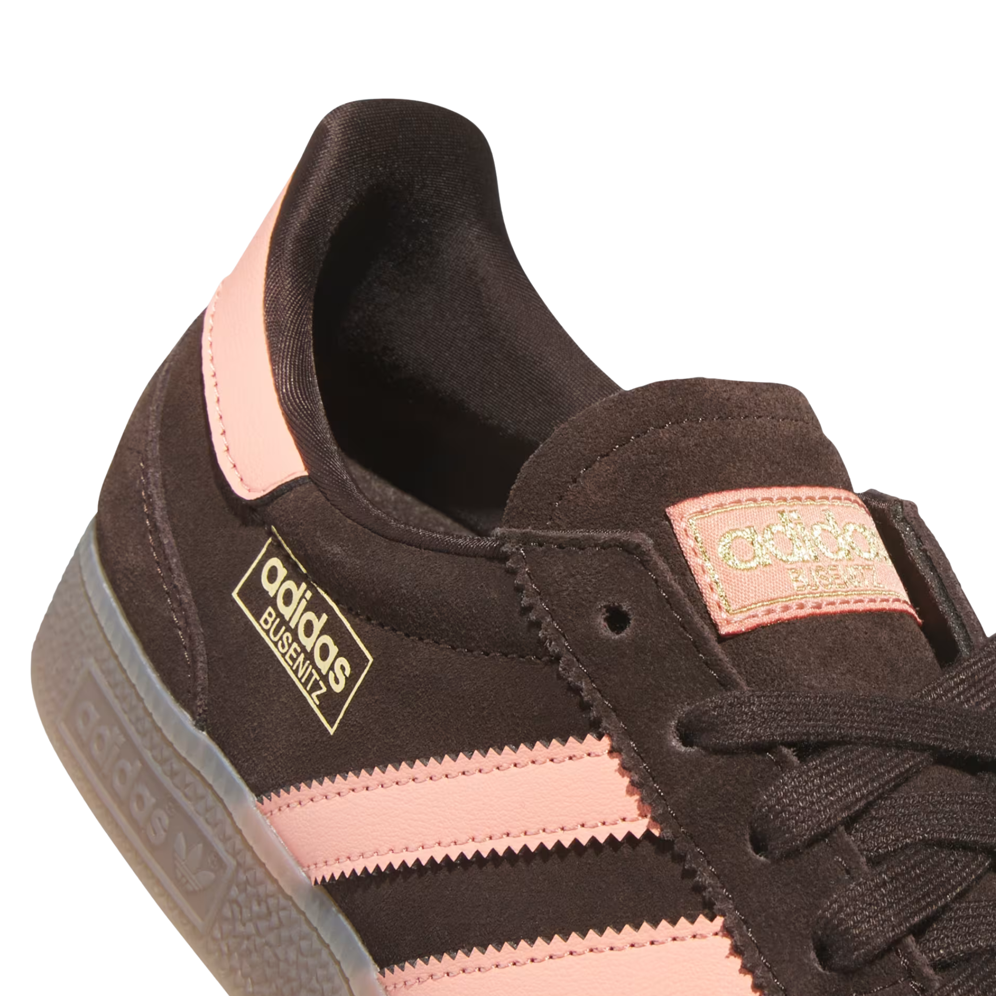 Brown Adidas busentiz adv skate sneaker with pink accents on a white background
