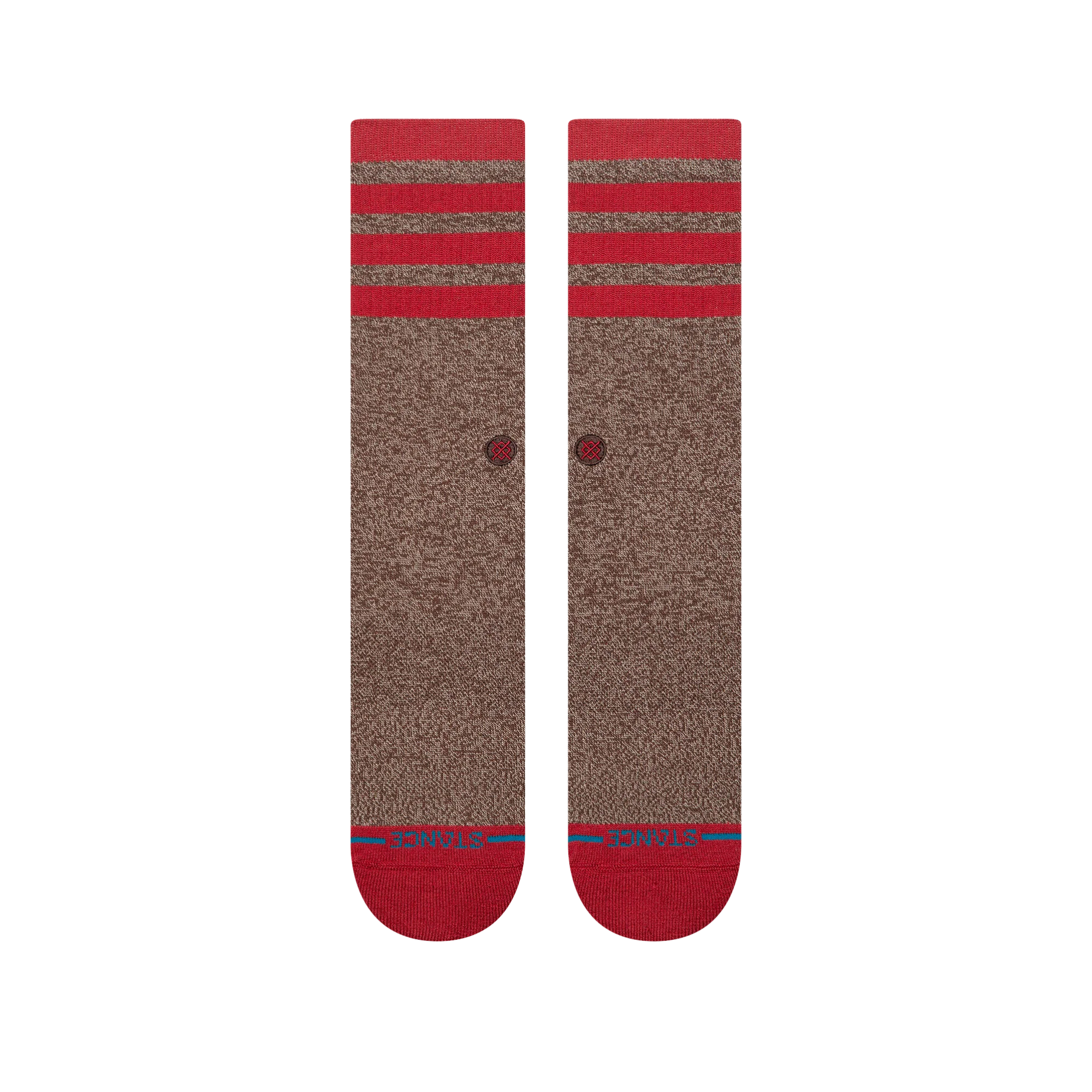 A pair of stance sock monkey crew socks in heathered brown with bright red stripes at the ribbed cuffs, red heels, and red toes, featuring a small red circular logo on the side.
