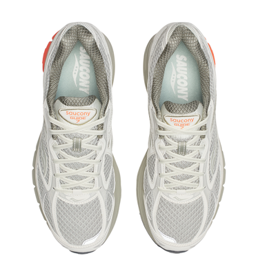 Gray tan saucony progrid guide 7 running shoe with orange sole on a white background