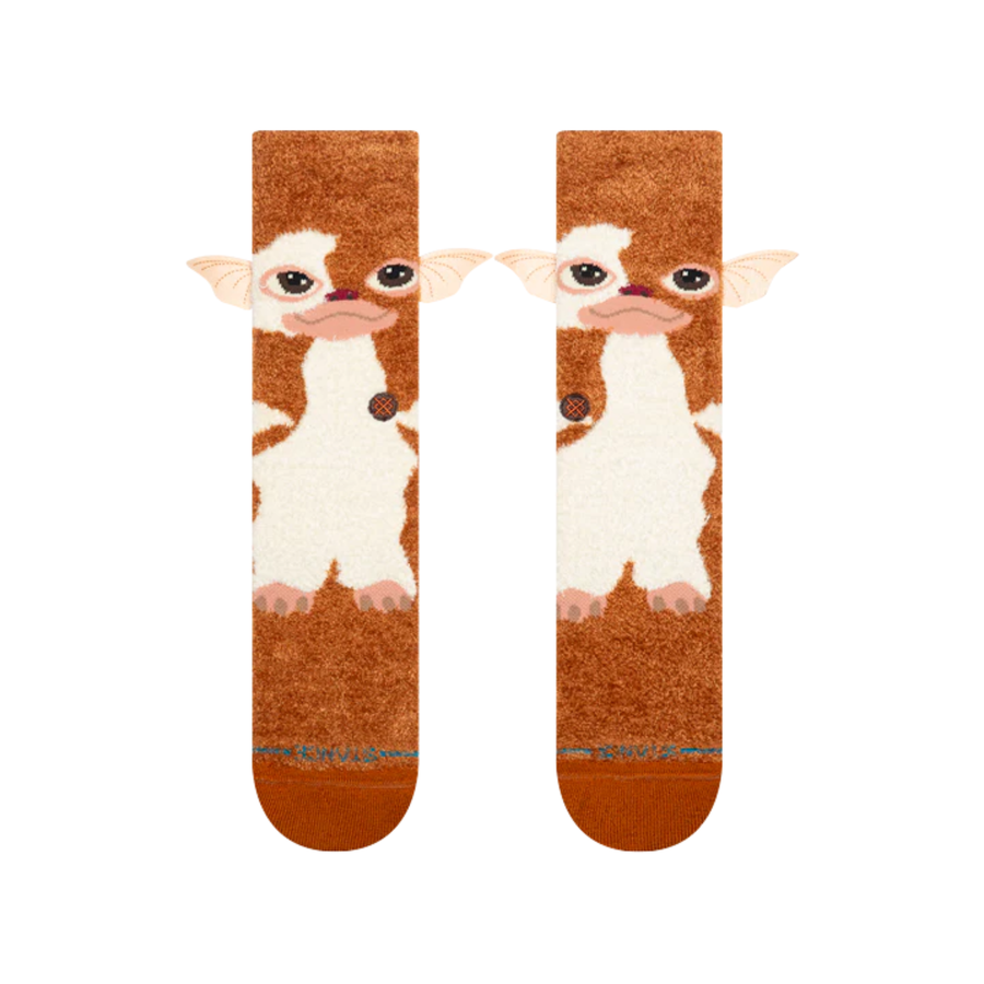 A pair of plush stance gizmo crew socks featuring a gizmo from gremlins brown and white, shown against a plain white background.