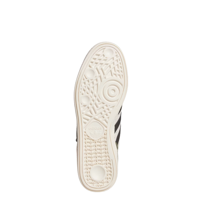 Beige and black Adidas BUSENITZ mens skateboard sneaker on a white background