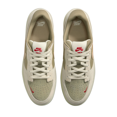 Beige nike sb force 58 sneaker with a brown accent on a white background