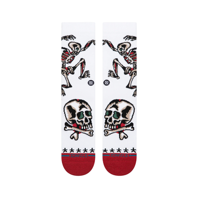 white stance x bert krak crew socks wth a skeleton and skulls and a red toe and heel on a white backgroun