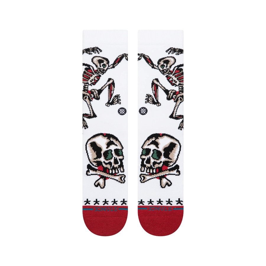 white stance x bert krak crew socks wth a skeleton and skulls and a red toe and heel on a white background