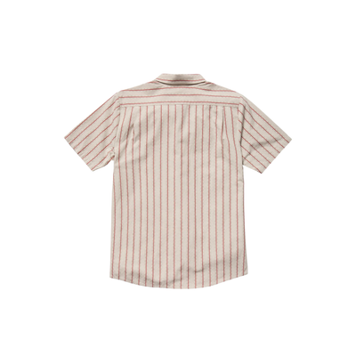 Man wearing a beige and red striped volcom sato stripe short sleeve shirt on a white background