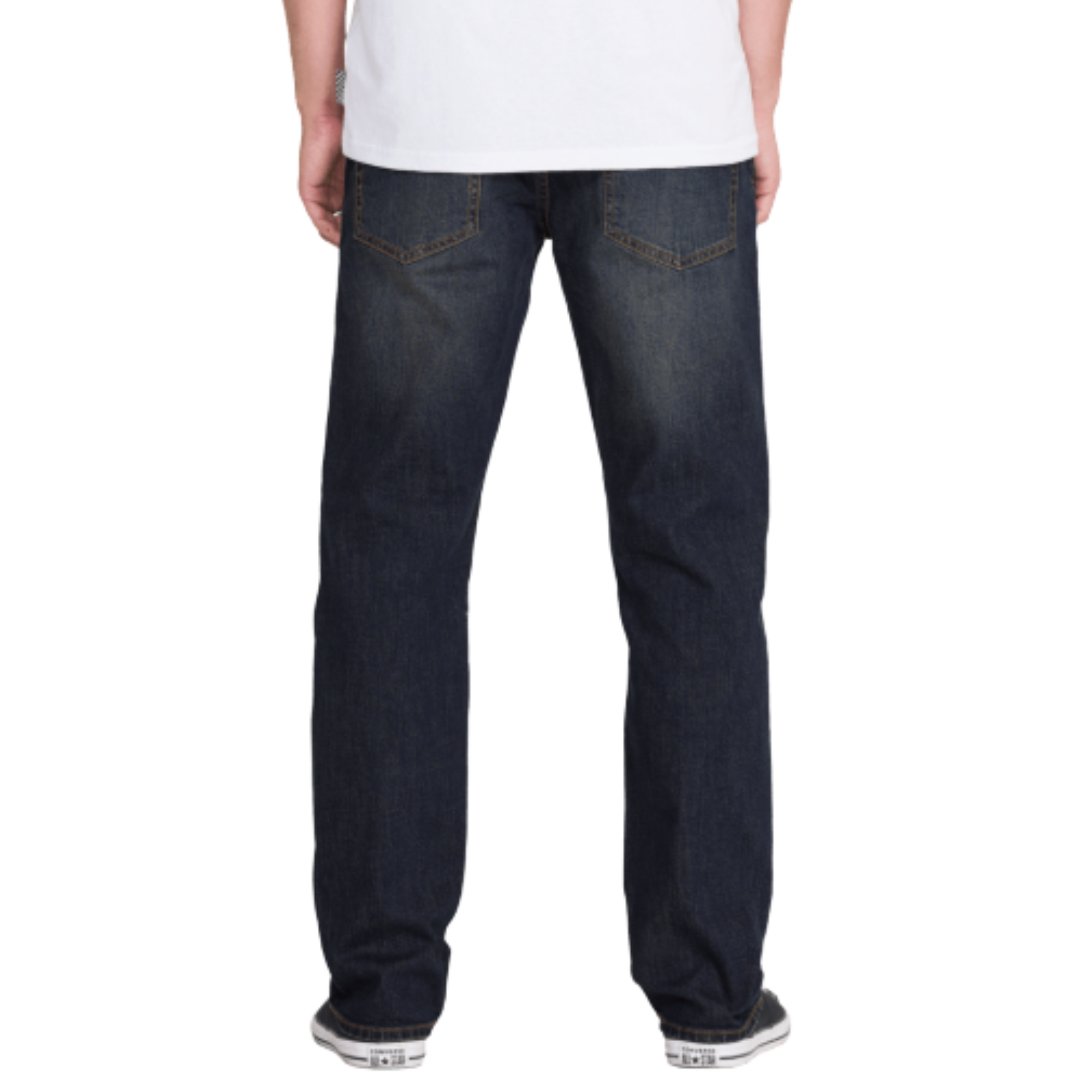 man in a white volcom logo t-shirt wearing dark blue volcom solver denim jeans with black converse all stars on a white background
