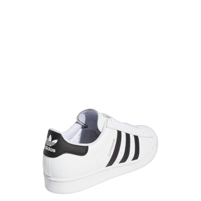 White Adidas Superstar sneaker with black stripes on a white background