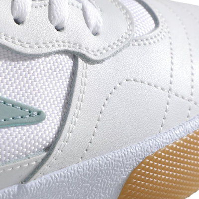 White lakai cambridge elite sneaker with light blue accents and brown sole on a white background