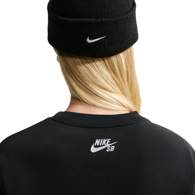 A model wearing a nike sb yuto horigome black t-shirt with 'AIR FORCE 1' printed across the chest in a colorful gradient pattern