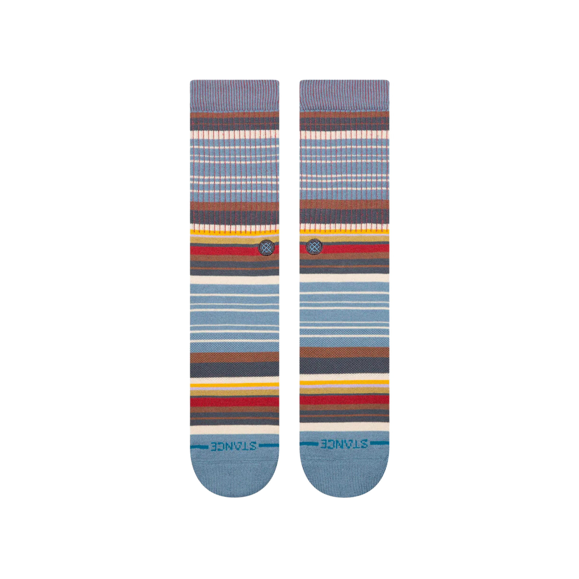 A pair of stance jorongo pop crew socks with a multicolor striped pattern featuring shades of blue, brown, red, yellow, and white, displayed against a plain white background.