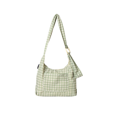 green and off white thread slouchy shoulder bag on a white background