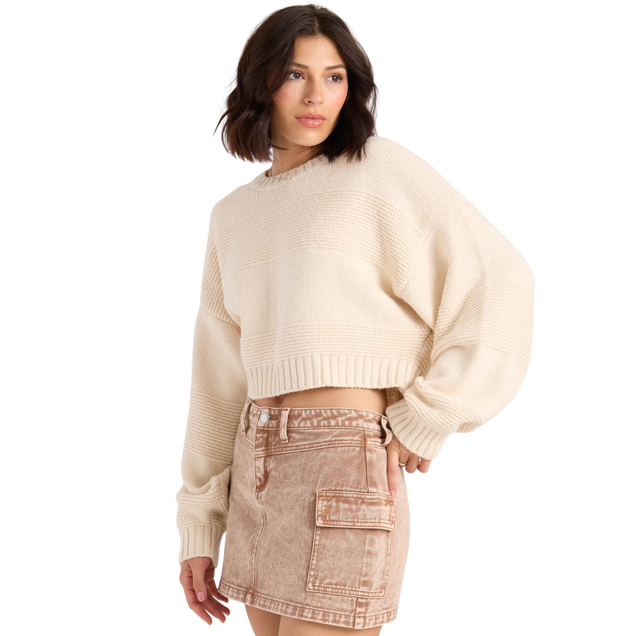 off white volcom dayz like this cropped long sleeve sweater on a woman against a white background