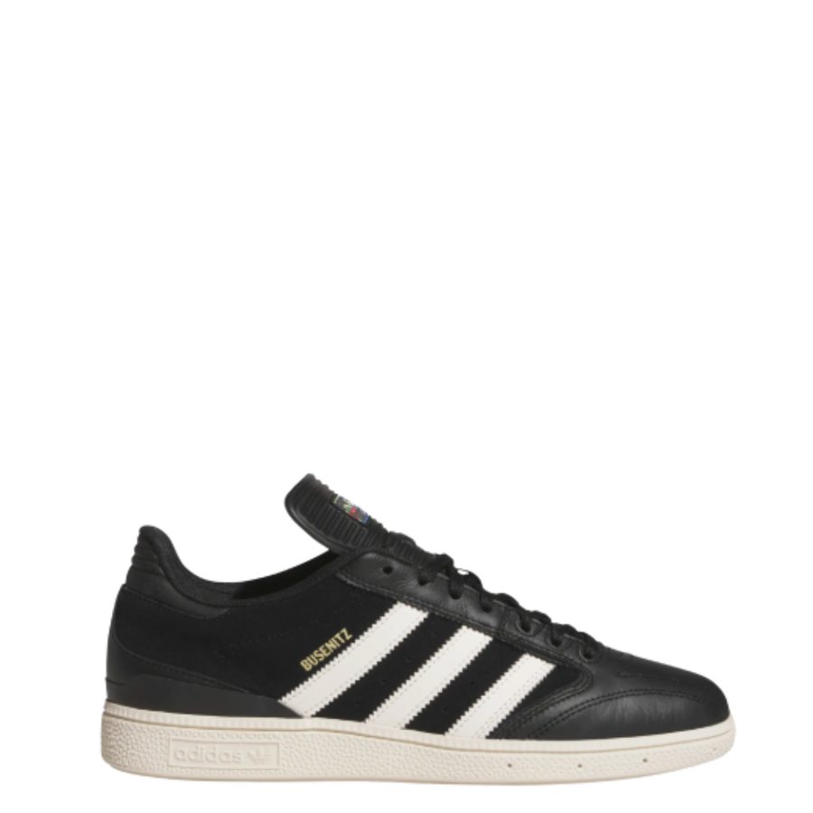 black leather adidas busenitz skateboard sneaker with an off white sole on a white background
