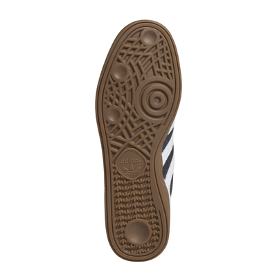 dark grey adidas busenitz skateboarding shoe with white strips and tongue and  gum sole on a white background