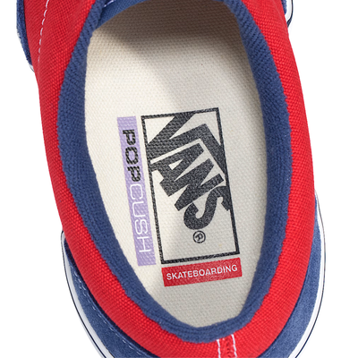 Blue and red vans era skateboard sneaker with white laces on a white background