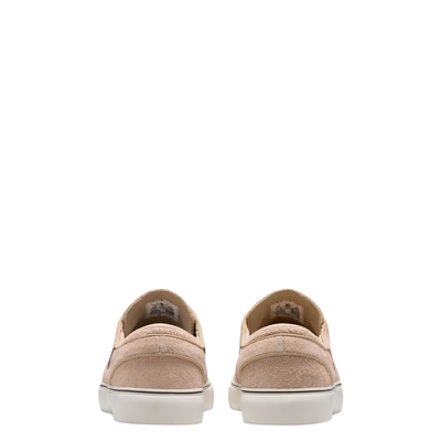 A Nike sb janoski low-top sneaker in a light beige suede and canvas mix, featuring a dark brown Swoosh logo, matching brown laces, and a thick white rubber sole.