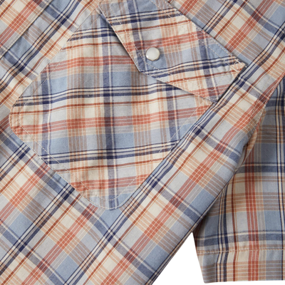 Close-up of a plaid shirt with a focus on the fabric pattern.