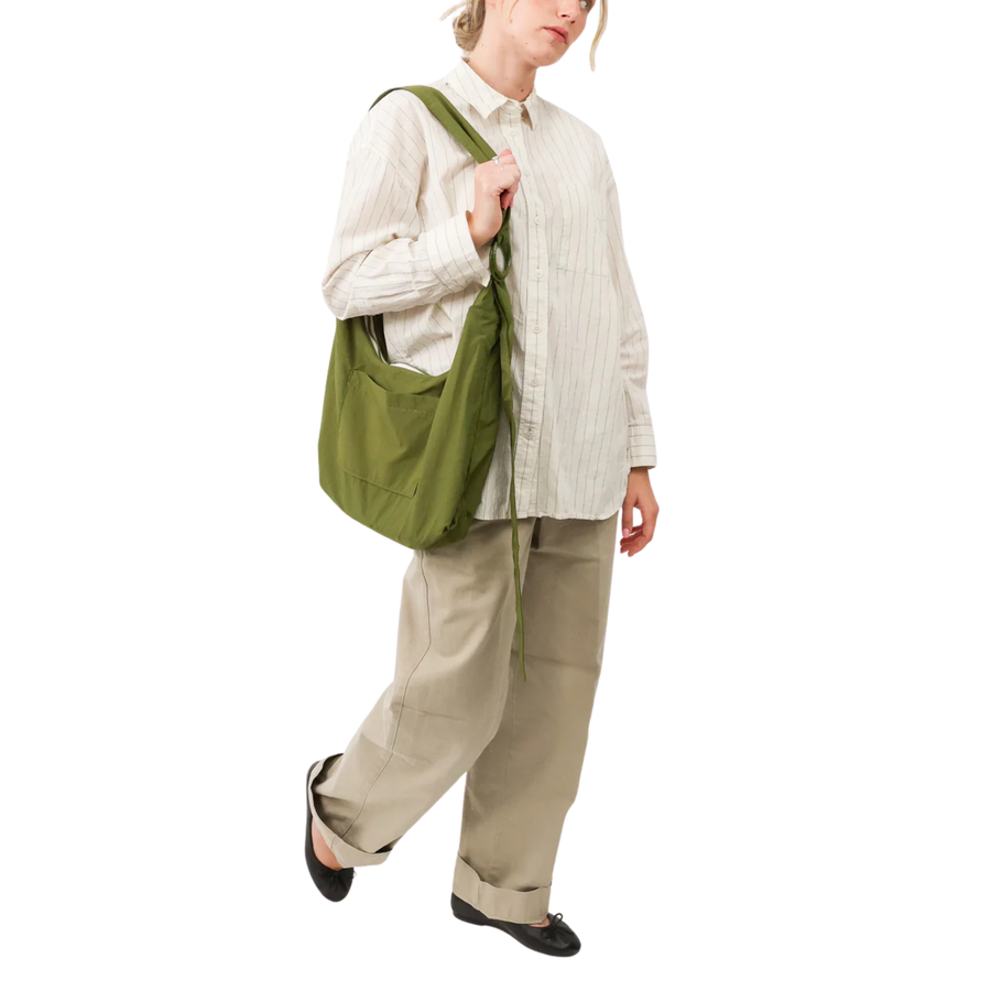 Green thread slouchy shoulder bag on a white background