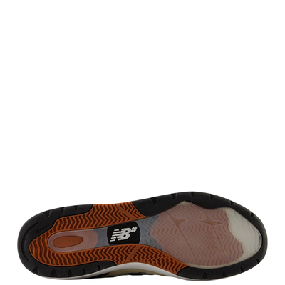bottom of a tan and brown men's new balance numeric andrew reynolds 933 skate shoe on a white background