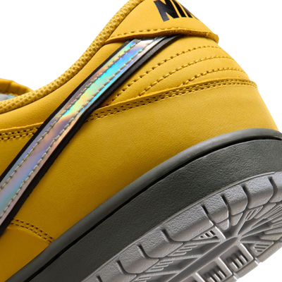 Yellow and teal NIKE SB MUNI FAST PASS sneaker with a visible Nike logo on a white background