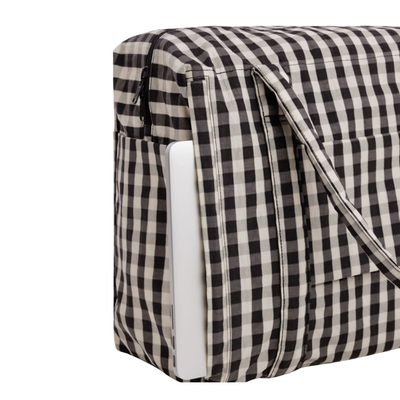 A black and white gingham checkered baggu cloud carry on tote bag with two shoulder straps, shown against a plain white background.