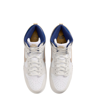 A pair of Nike SB X Beyond Skate Shop  dunk high sneakers shown from a top-down view. The shoes are primarily white with a blue collar lining, beige side accents, and white laces.