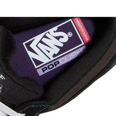 Black  vans united by skateboarding half cab mid-top sneaker with white laces on a white background