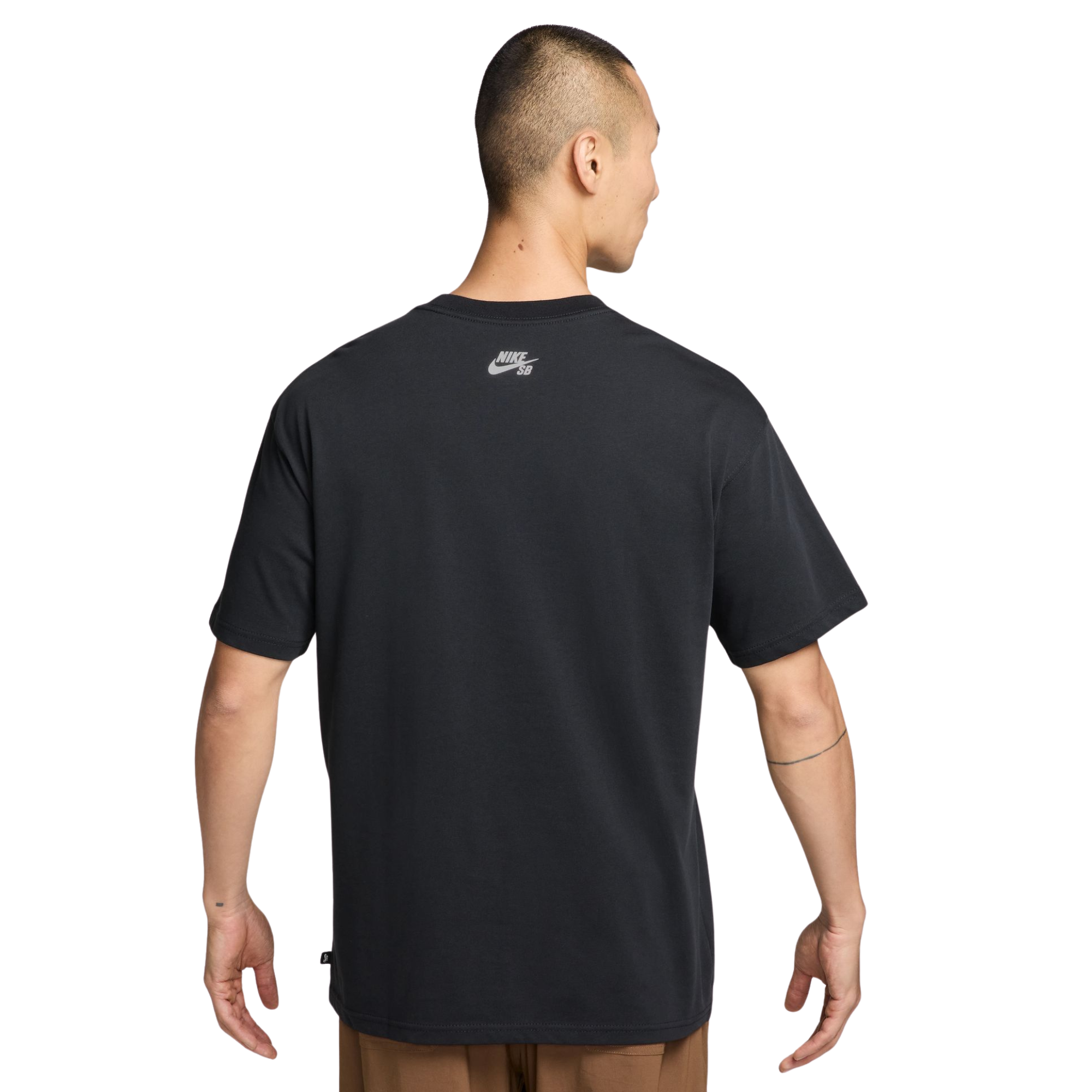 A man viewed from the back wearing an oversized black Nike t-shirt with a small white Nike logo on the upper back, set against a plain white background.