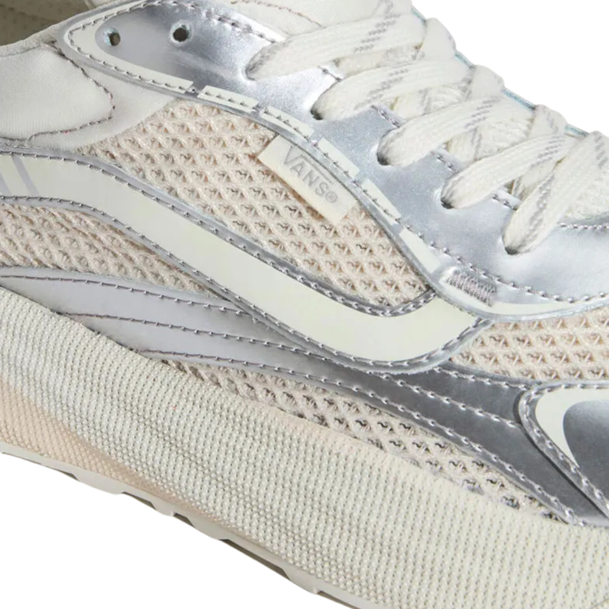 close up of a low-top vans ultrarange neo 2.0 sneaker shown in profile against a solid white background. The shoe features a cream-colored knit upper with metallic silver overlays, a chunky cream midsole, and white laces.
